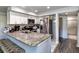 Modern kitchen with white cabinets, granite countertops, and stainless steel appliances at 7270 Westpointe Blvd # 914, Orlando, FL 32835