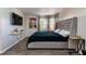 Spacious main bedroom with king-size bed and large TV at 7270 Westpointe Blvd # 914, Orlando, FL 32835