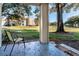 Private patio with chair, overlooking green space at 7270 Westpointe Blvd # 914, Orlando, FL 32835