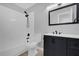 Modern bathroom with dark vanity and updated fixtures at 1035 S Hiawassee Rd # 2722, Orlando, FL 32835