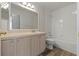 Clean bathroom with light wood cabinets and a bathtub at 13303 Pinyon Dr, Clermont, FL 34711