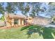 House exterior showcasing landscaping and curb appeal at 13303 Pinyon Dr, Clermont, FL 34711