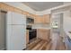 Kitchen with stainless steel appliances and light wood cabinets at 13303 Pinyon Dr, Clermont, FL 34711