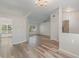 Open living room with laminate flooring and neutral walls, showcasing natural light at 13303 Pinyon Dr, Clermont, FL 34711