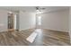 Spacious living area with wood-look floors and natural light at 13303 Pinyon Dr, Clermont, FL 34711
