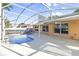 Inviting screened pool and patio with a spacious layout at 13303 Pinyon Dr, Clermont, FL 34711