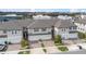 Townhome community with multiple units, showcasing rooflines and landscaping at 15211 Willow Arbor Cir, Orlando, FL 32824
