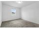 Simple bedroom with carpeted floor and window at 15211 Willow Arbor Cir, Orlando, FL 32824