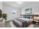 Primary bedroom with large bed and window at 15211 Willow Arbor Cir, Orlando, FL 32824