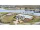 Community pool with adjacent playground at 15211 Willow Arbor Cir, Orlando, FL 32824