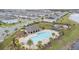 Community pool and playground near lake at 15211 Willow Arbor Cir, Orlando, FL 32824