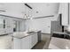 Open concept kitchen featuring a large island and stainless steel appliances at 15211 Willow Arbor Cir, Orlando, FL 32824