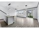 Open concept living room and kitchen with hardwood floors at 15211 Willow Arbor Cir, Orlando, FL 32824