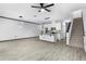 Open living area with kitchen and staircase at 15211 Willow Arbor Cir, Orlando, FL 32824