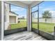Screened patio with view of backyard at 15211 Willow Arbor Cir, Orlando, FL 32824