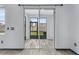 Glass doors open to a spacious screened patio at 15211 Willow Arbor Cir, Orlando, FL 32824