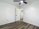 Bedroom with grey flooring, ceiling fan and access to hallway at 2801 Kinnon Dr, Orlando, FL 32817