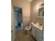 Clean bathroom with a toilet, sink, and bathtub at 305 Hope Cir, Orlando, FL 32811