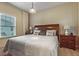 Primary bedroom with king-size bed and en-suite bathroom at 3214 Gold Ln, Kissimmee, FL 34747