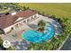 Aerial view of resort-style pool with lounge chairs and spa at 3214 Gold Ln, Kissimmee, FL 34747