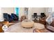 Community room with comfortable seating, massage chairs, and work area at 3214 Gold Ln, Kissimmee, FL 34747