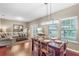 Open concept dining area with wood flooring and a chandelier at 3214 Gold Ln, Kissimmee, FL 34747