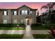 Two-story townhome with neutral siding and landscaping at 3214 Gold Ln, Kissimmee, FL 34747