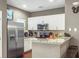 Modern kitchen with stainless steel appliances and granite countertops at 3214 Gold Ln, Kissimmee, FL 34747