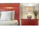 Wooden nightstand with a lamp and decorative accents at 3214 Gold Ln, Kissimmee, FL 34747