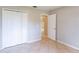 Bedroom with tile floors and double door closet at 406 Fred St, Orlando, FL 32811