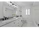 Updated bathroom with double vanity, granite countertop, and modern fixtures at 5016 Dorman Rd, Lakeland, FL 33813