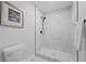Clean bathroom with walk-in shower and marble tile at 5016 Dorman Rd, Lakeland, FL 33813