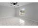 Bedroom with tile floors and two windows at 5016 Dorman Rd, Lakeland, FL 33813