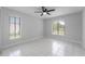 Bedroom with tile floors and ceiling fan at 5016 Dorman Rd, Lakeland, FL 33813