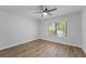 Bright bedroom with hardwood floors and large window at 5016 Dorman Rd, Lakeland, FL 33813