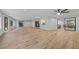 Spacious Gathering room featuring wood-look floors and access to a covered patio at 5016 Dorman Rd, Lakeland, FL 33813
