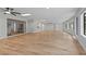 Open Gathering room showcasing wood-look floors and views of the pool at 5016 Dorman Rd, Lakeland, FL 33813