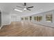 Bright and airy Gathering room with wood-look floors and access to outdoor space at 5016 Dorman Rd, Lakeland, FL 33813