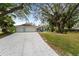 Spacious driveway leading to a charming house with mature trees at 5016 Dorman Rd, Lakeland, FL 33813