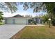 Three-car garage and well-maintained landscaping at 5016 Dorman Rd, Lakeland, FL 33813