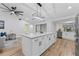 Updated kitchen with island, stainless steel appliances, and hardwood floors at 5016 Dorman Rd, Lakeland, FL 33813