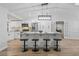 Modern kitchen featuring white cabinets, granite countertops, and a large island at 5016 Dorman Rd, Lakeland, FL 33813