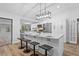 Bright kitchen boasts a spacious island, white cabinetry, and stainless steel appliances at 5016 Dorman Rd, Lakeland, FL 33813