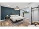 Main bedroom with wood floors and geometric accent wall at 510 Cocoa Ln, Orlando, FL 32804