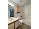 Bathroom features a tub, toilet, and vanity with wood cabinets at 627 Dory Ln # 102, Altamonte Springs, FL 32714