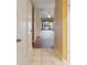 Hallway with tiled floor and view of living room and patio at 1055 Kensington Park # 613, Altamonte Springs, FL 32714