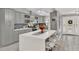 Modern kitchen with gray cabinets and a large island at 11533 Sandy Hill Dr, Orlando, FL 32821