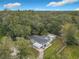 Aerial view of house, showing property and surrounding trees at 143 N Woodward Ave, Deland, FL 32720