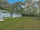 Spacious backyard with grassy area and detached structure at 143 N Woodward Ave, Deland, FL 32720