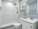 Updated bathroom with walk-in shower and gray walls at 143 N Woodward Ave, Deland, FL 32720